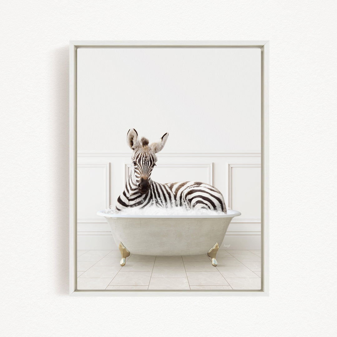 A zebra is sitting in a white bathtub, surrounded by a white wall and tiled floor.