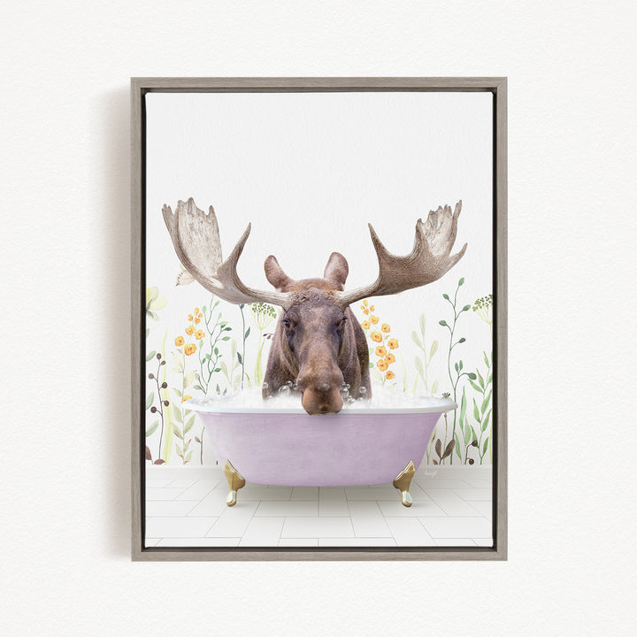 A moose with large antlers is sitting in a purple bathtub, surrounded by flowers and plants.