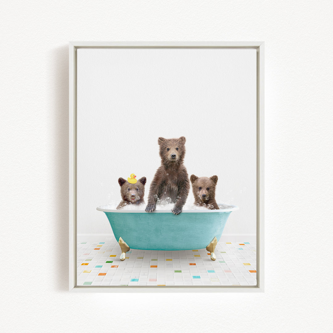 Three adorable brown bears sitting in a blue bathtub, with one bear sitting in the center and two bears sitting on either side.