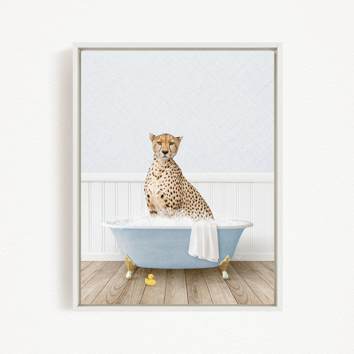 A cheetah sitting in a blue bathtub filled with water, surrounded by rubber duckies.