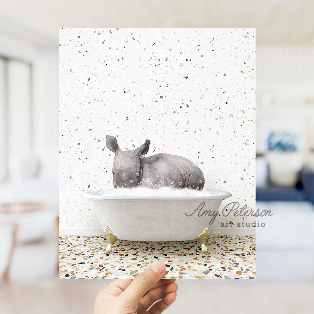 a rhinoceros sitting in a bathtub in a bathroom