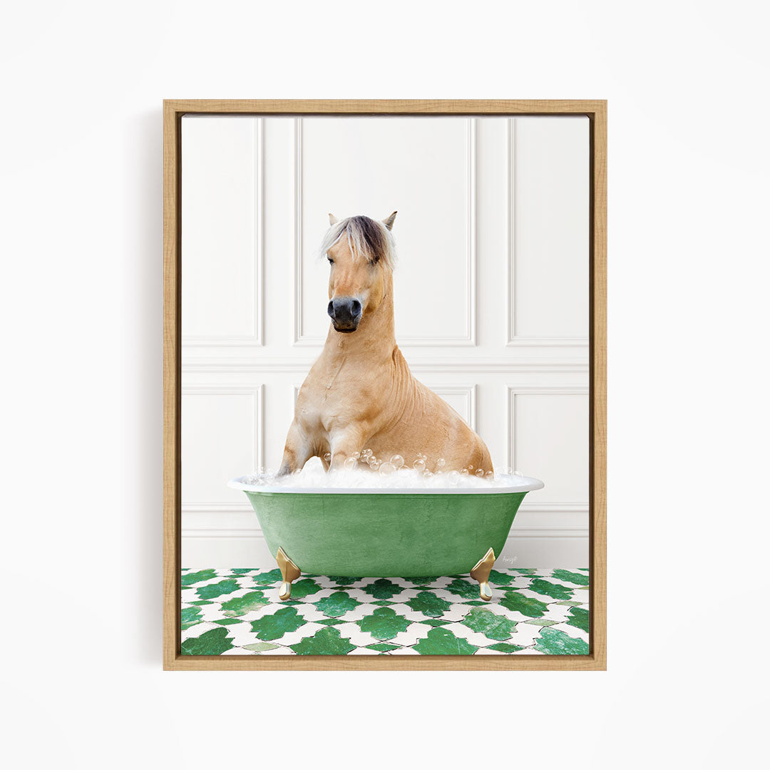 A light brown horse is sitting in a green bathtub filled with water, surrounded by a green and white patterned floor.
