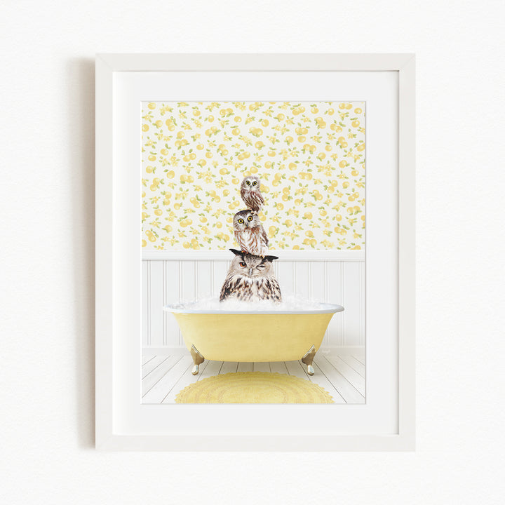 A framed image depicting a white owl sitting in a yellow bathtub filled with water, surrounded by a yellow floral pattern on the wall.