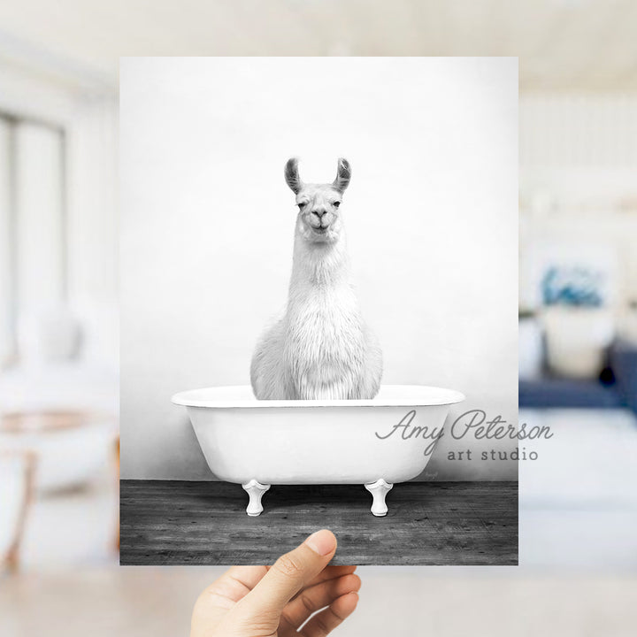 a llama sitting in a bathtub in a bedroom