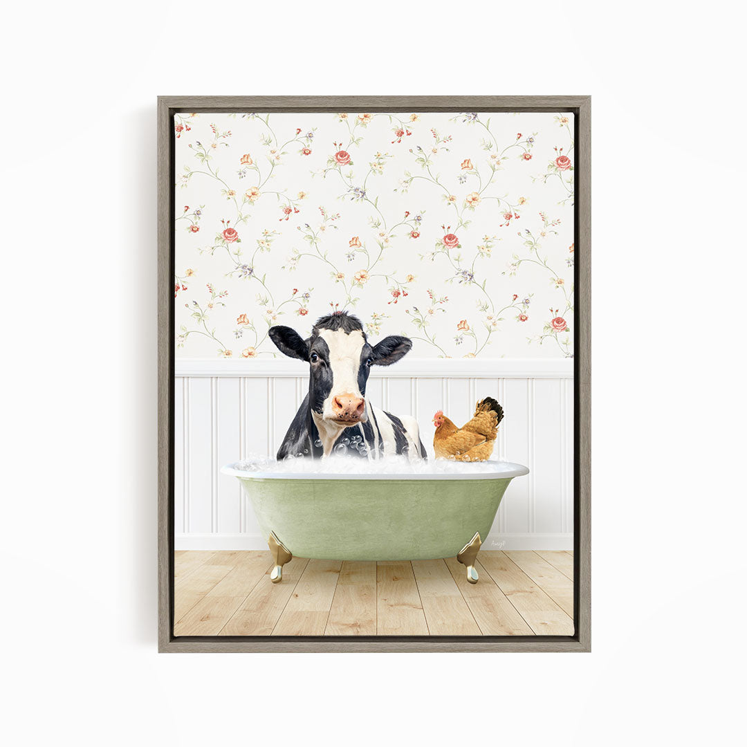 A black and white cow is sitting in a green bathtub, surrounded by a chicken and a rooster, against a floral wallpaper backdrop.