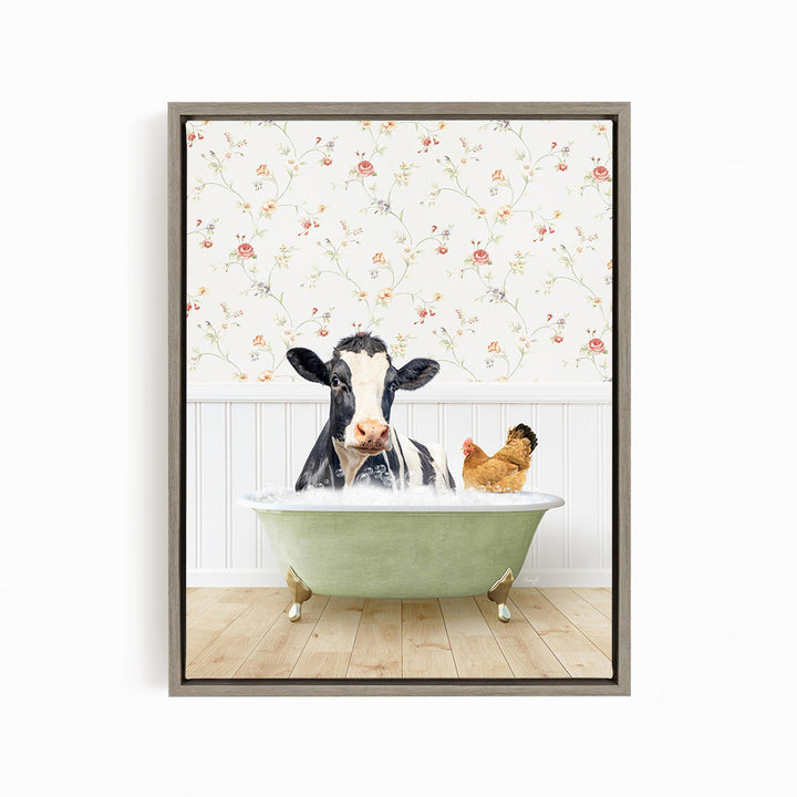 A black and white cow is sitting in a green bathtub, surrounded by a chicken and a rooster, against a floral wallpaper backdrop.