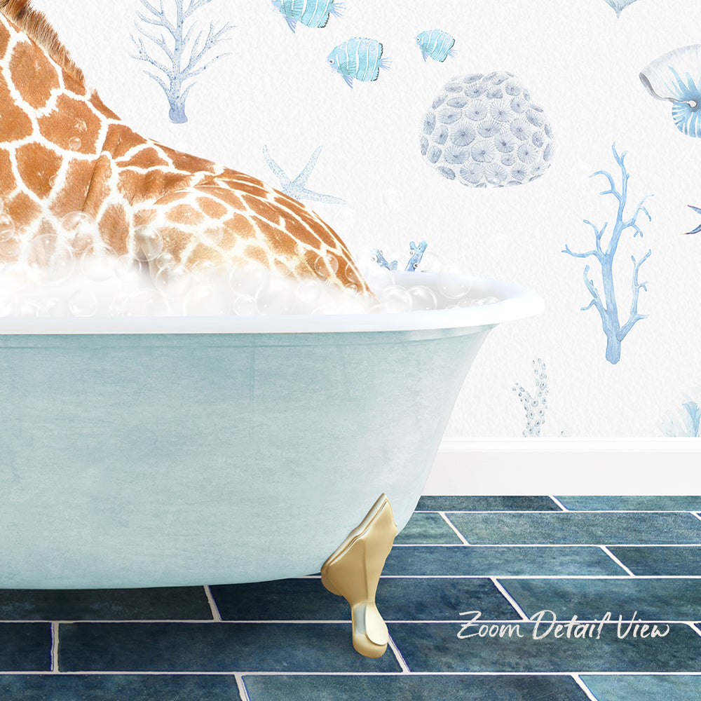 A giraffe is sitting in a bathtub filled with bubbles, surrounded by a blue and white ocean-themed wallpaper.