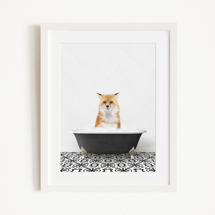 A red fox is sitting in a black bathtub filled with water, with a black and white patterned tile floor beneath it.