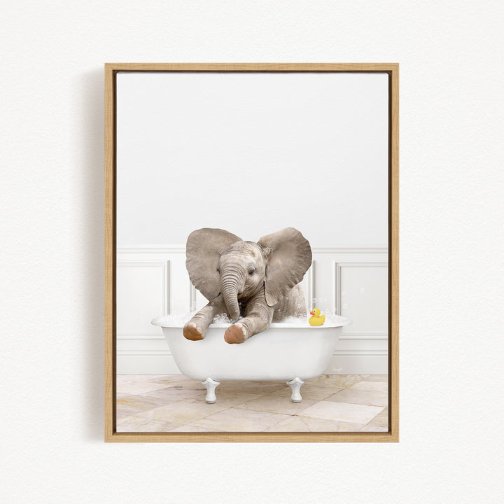 A baby elephant sitting in a bathtub, with a rubber duck floating nearby.