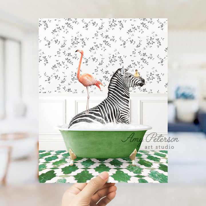 a hand holding a card with a zebra and a flamingo in a bathtub