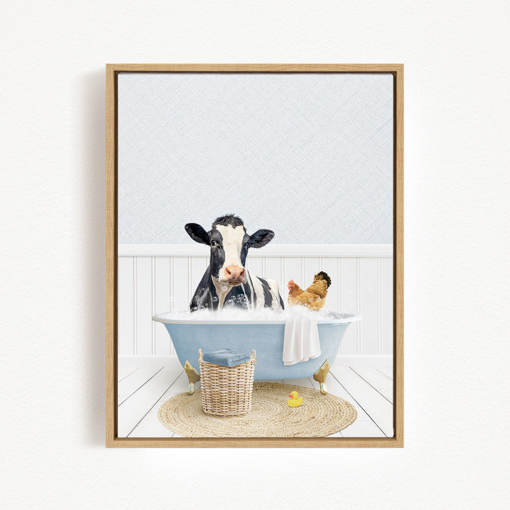 A black and white cow is sitting in a blue bathtub, surrounded by a chicken and a rubber duck, creating a whimsical and playful scene.