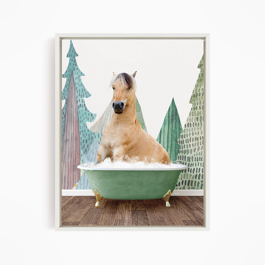 A light brown horse is sitting in a green bathtub, surrounded by a forest-themed background with trees and foliage.