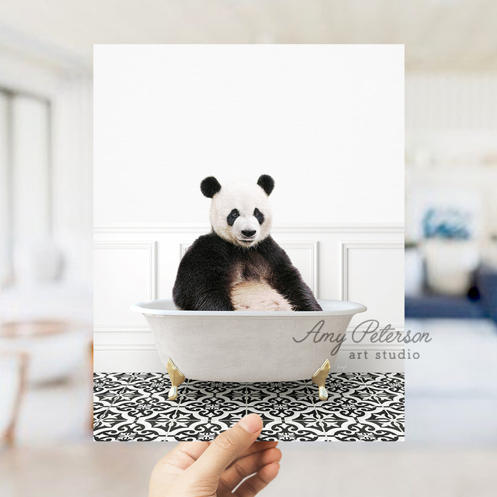 a panda bear sitting in a bath tub