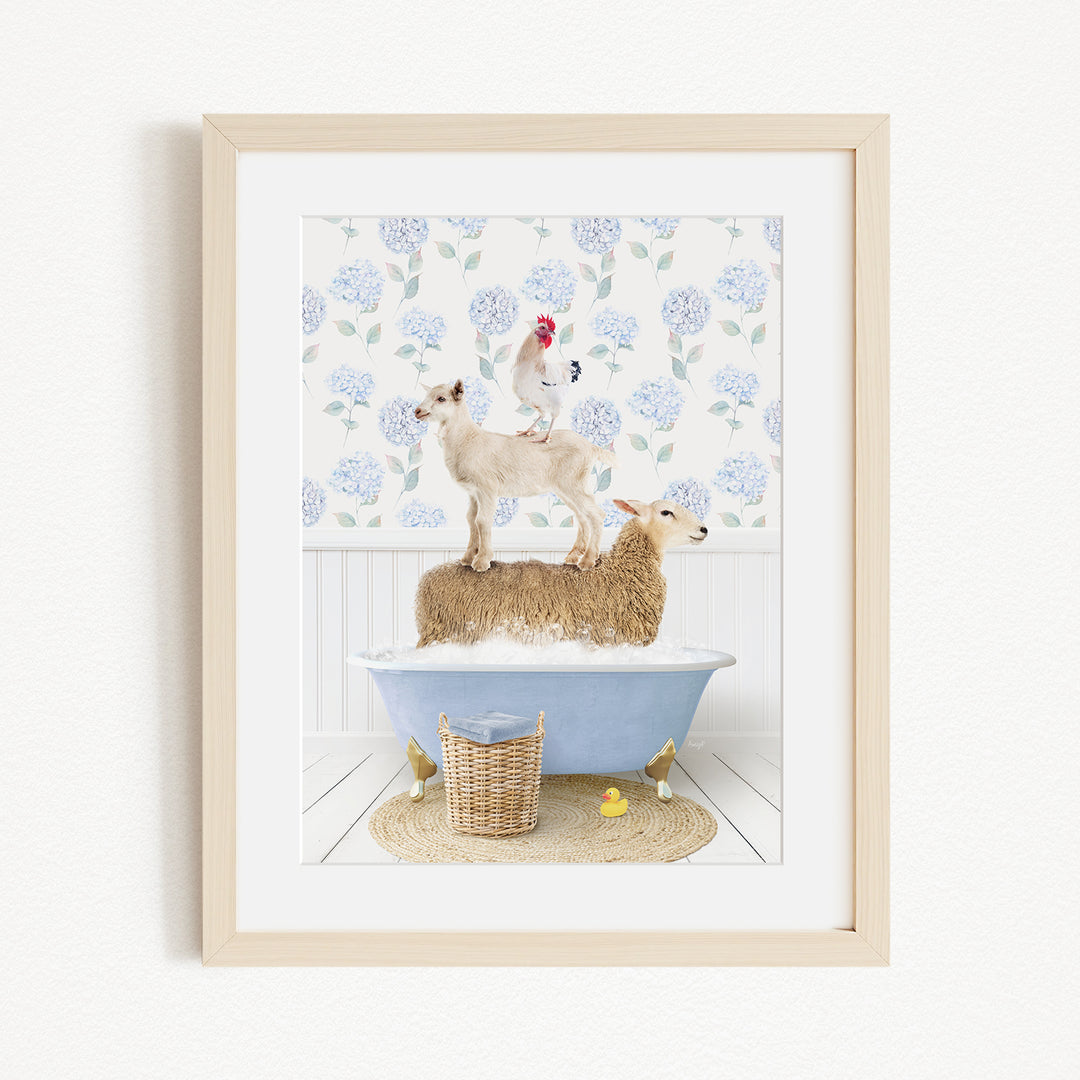 A framed image depicting a sheep standing in a bathtub, with a chicken perched on its back, and a rooster standing on its head.