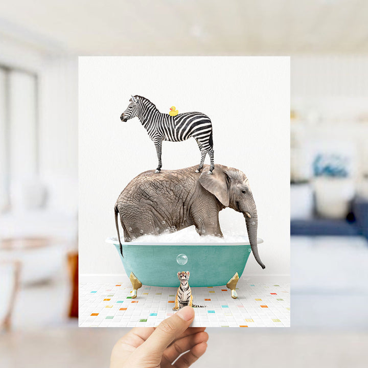 A hand holds up a collage of images depicting a zebra standing on an elephant's back while both animals are in a bathtub filled with bubbles.