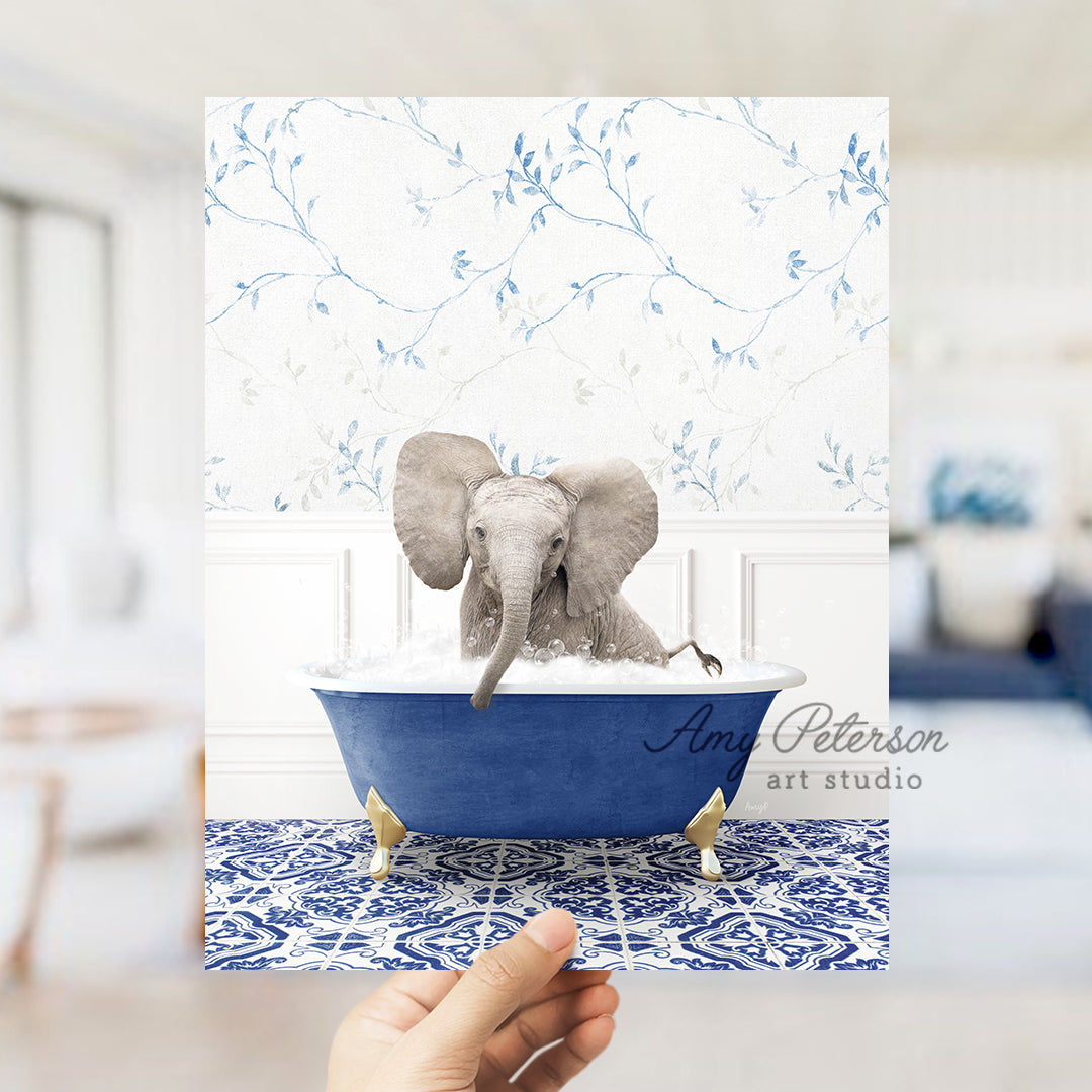 a person holding up a card with an elephant in a bathtub