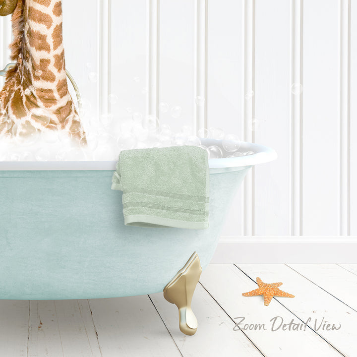 A giraffe standing in a bathtub filled with water, with a towel hanging on the side and a starfish on the floor.