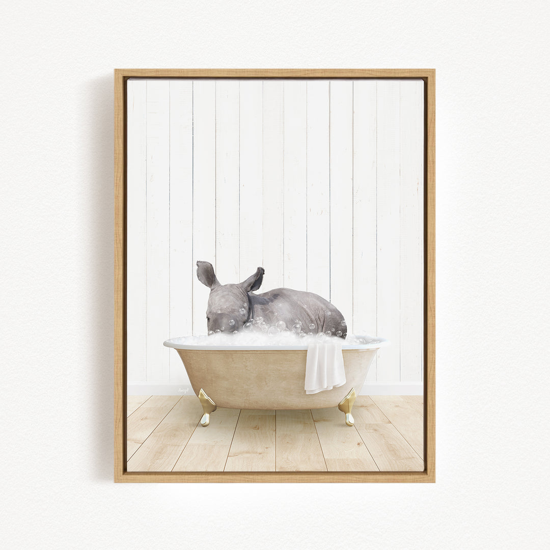 A gray rabbit is sitting in a bathtub filled with water, surrounded by a white wooden wall.