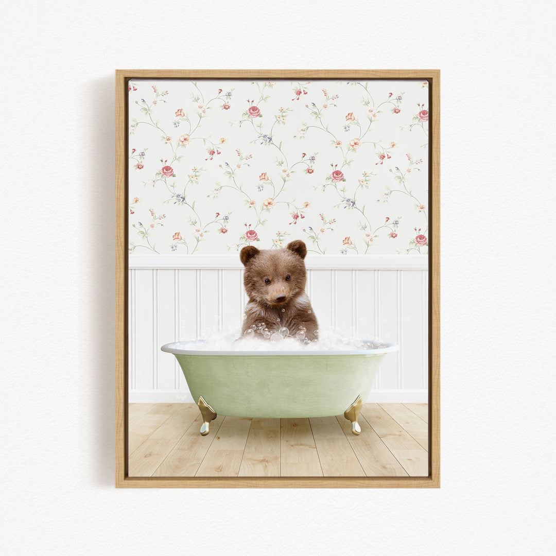 A brown bear sitting in a green bathtub filled with water, with a floral wallpaper in the background.