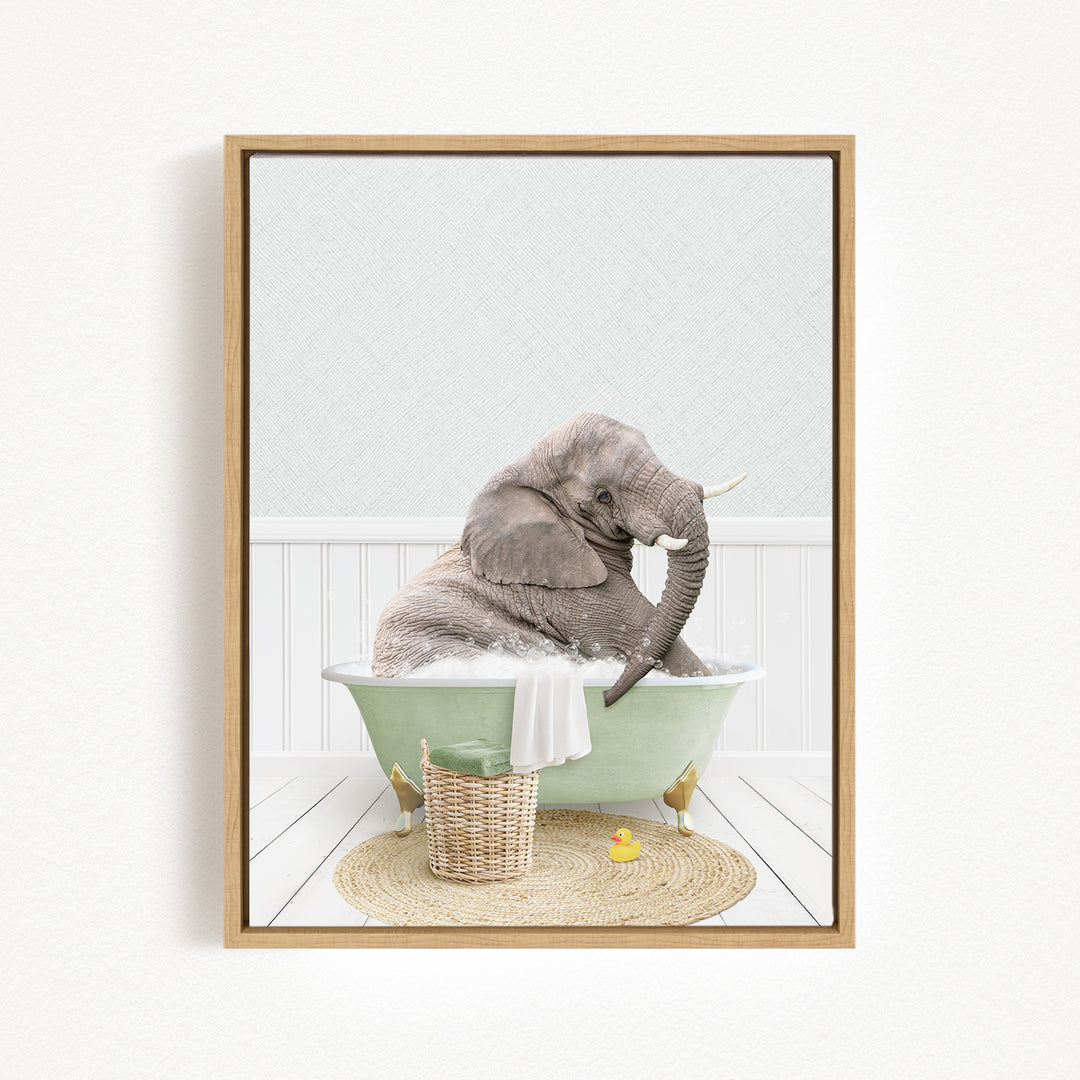 A gray elephant is sitting in a green bathtub, surrounded by a basket of toys and a yellow rubber duck, creating a whimsical and playful scene.