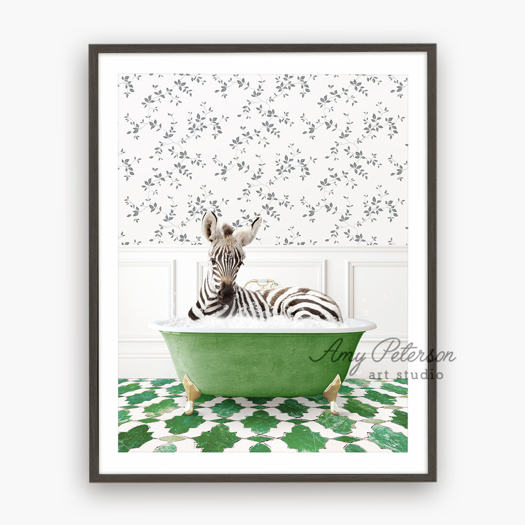 a zebra laying in a green bath tub