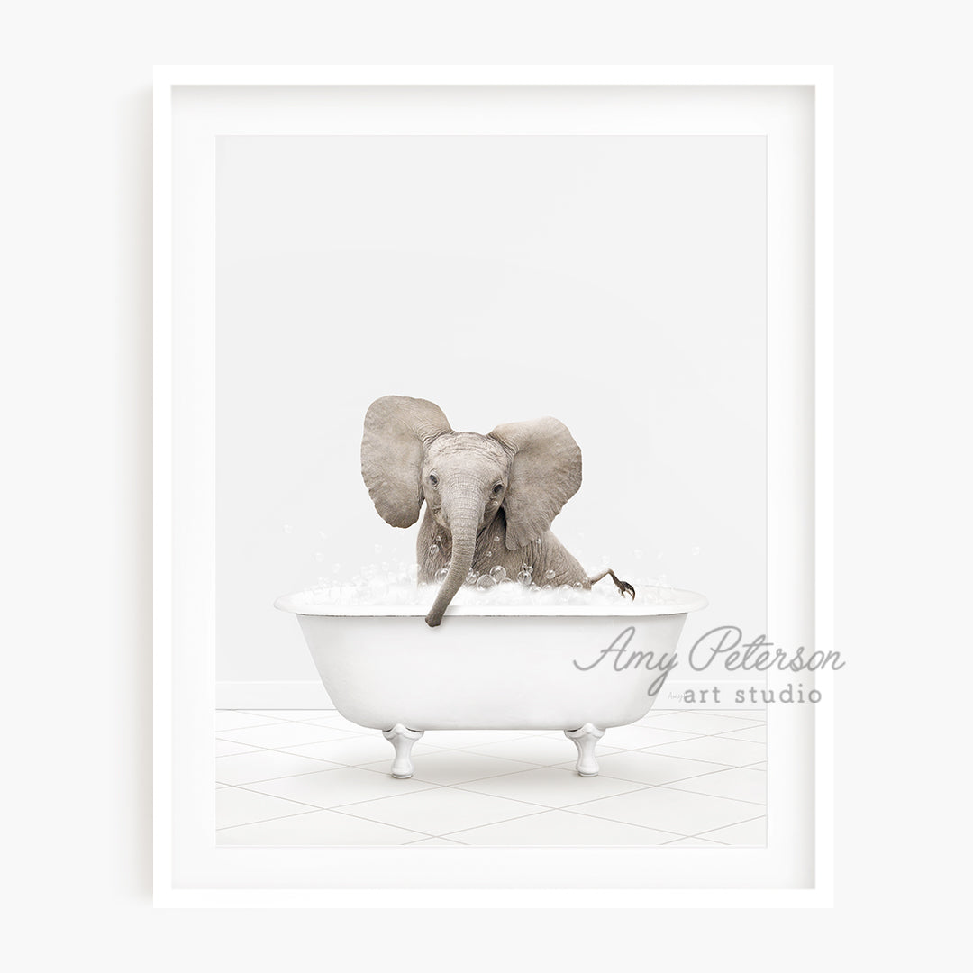 a picture of an elephant taking a bath