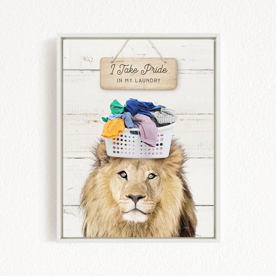 A framed image of a lion with a basket of laundry on its head, accompanied by a wooden sign that reads "I Take Pride in my Laundry".