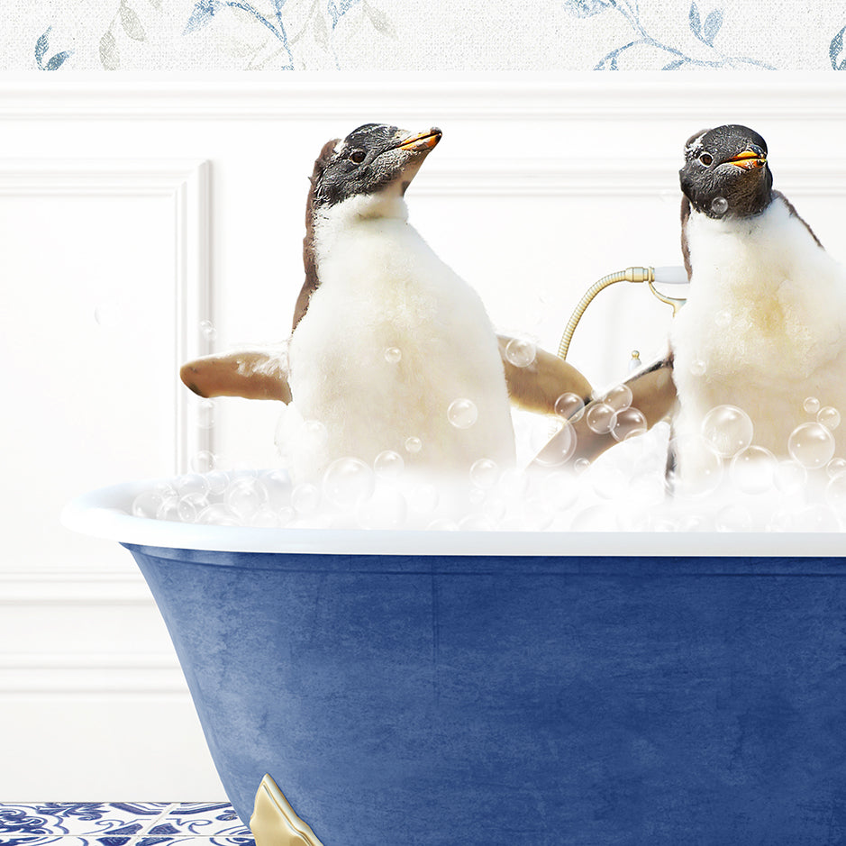 two penguins sitting in a bathtub with bubbles