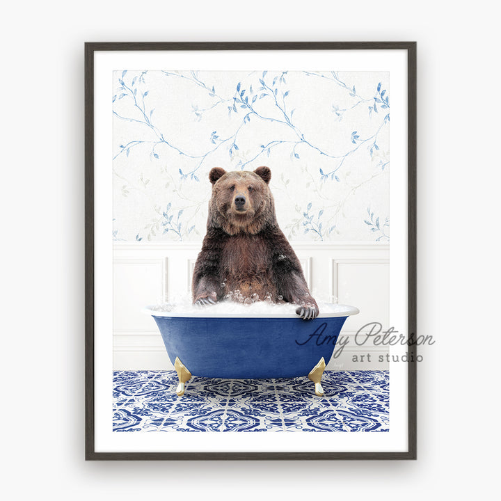 a brown bear sitting in a blue bath tub