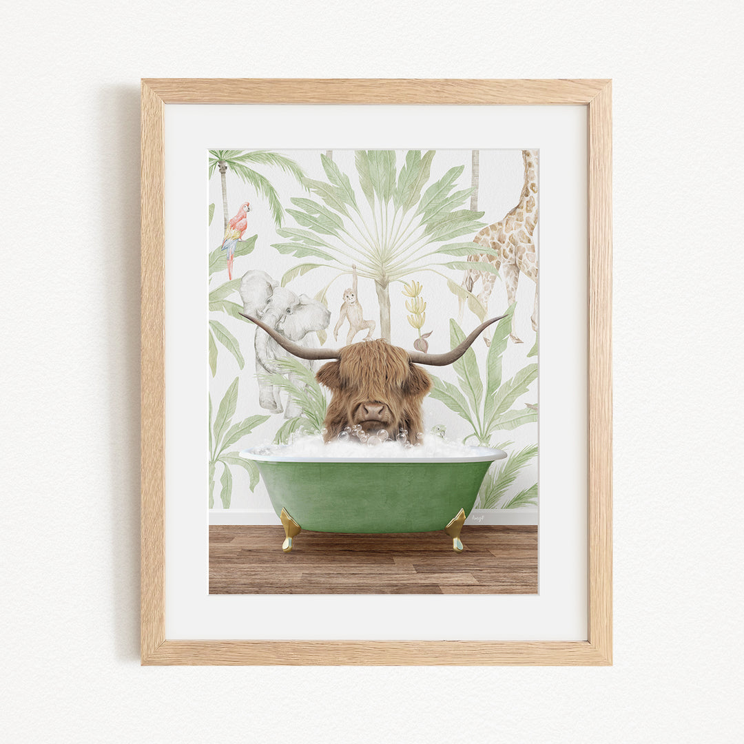 A framed illustration depicting a horned animal, likely a yak or a bison, sitting in a green bathtub filled with water, surrounded by tropical foliage.