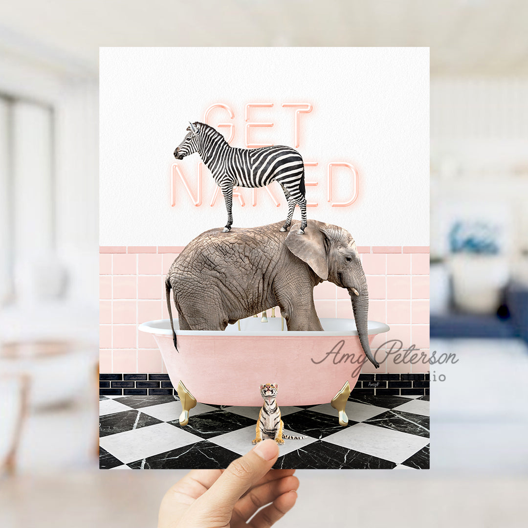 a person holding up a card with a picture of a zebra and an elephant in