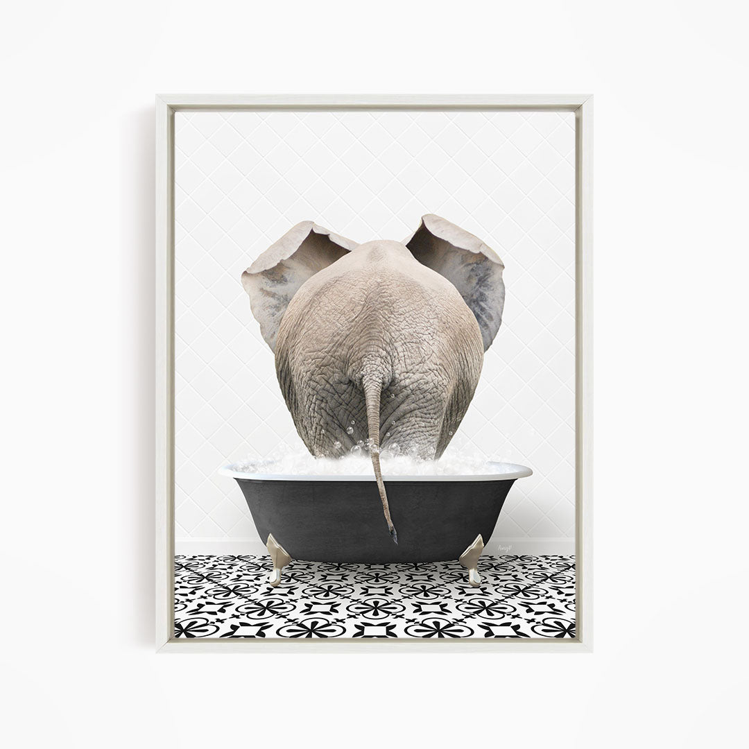 A large gray elephant is standing in a black bathtub filled with water, with its back turned to the viewer.