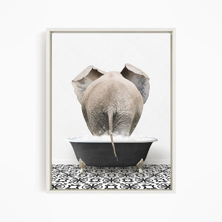 A large gray elephant is standing in a black bathtub filled with water, with its back turned to the viewer.