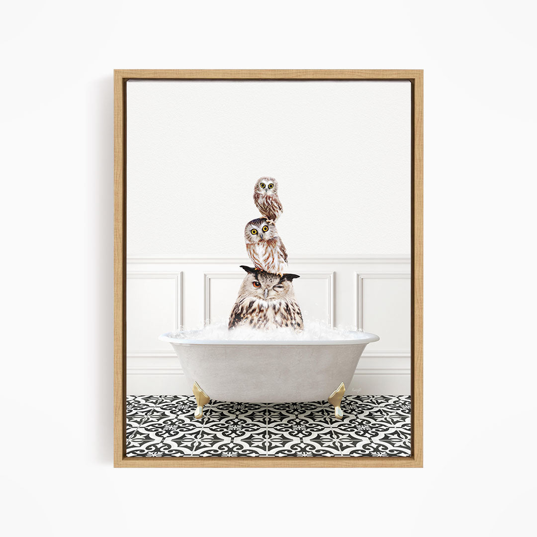 A framed image depicting a group of owls sitting in a bathtub filled with water, creating a whimsical and playful scene.