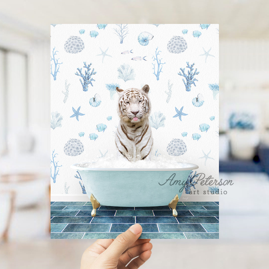 a hand holding a photo of a white tiger in a bathtub