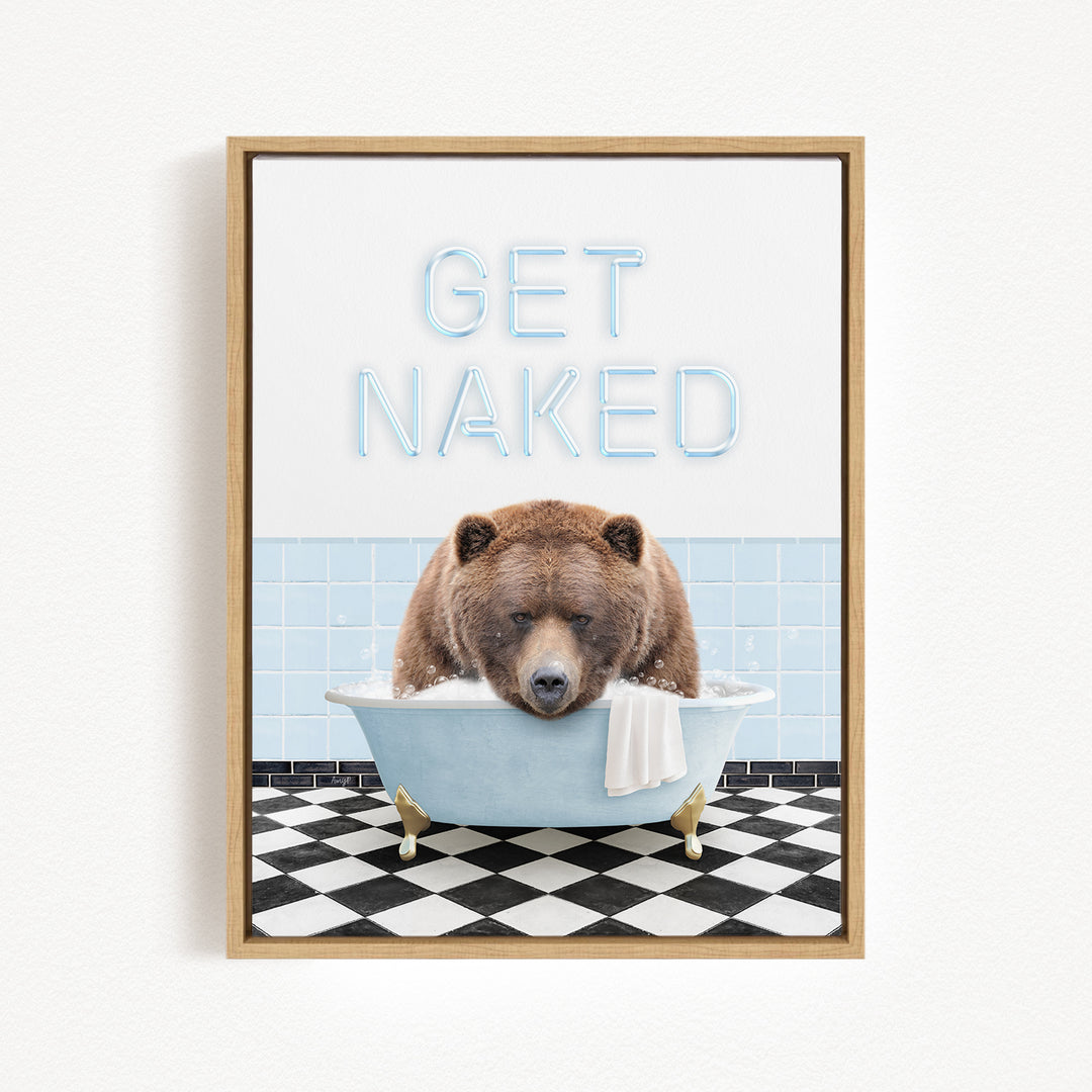 A framed image depicting a brown bear sitting in a bathtub with the text "GET NAKED" written above it.