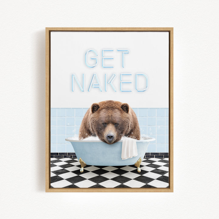 A framed image depicting a brown bear sitting in a bathtub with the text "GET NAKED" written above it.