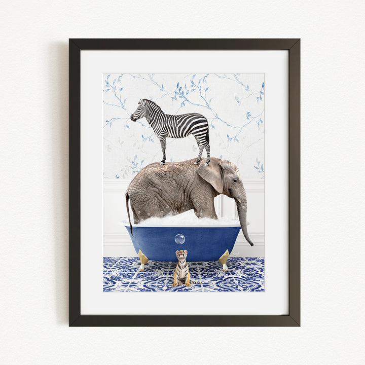 A framed image depicting a zebra standing on an elephant's back while the elephant is submerged in a blue bathtub, with a tiger sitting on the edge of the tub.