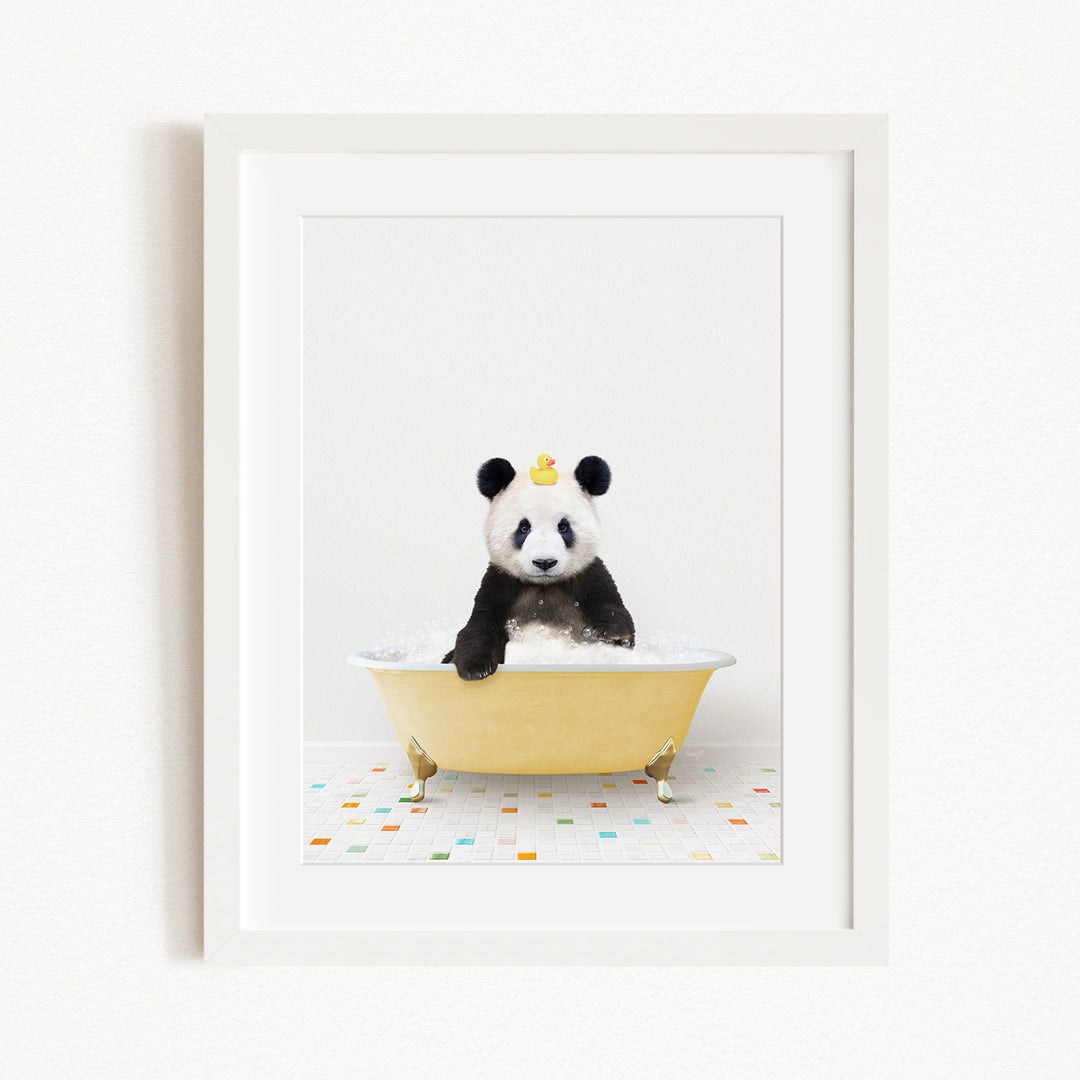 A panda bear sitting in a yellow bathtub, with a rubber duck on its head.