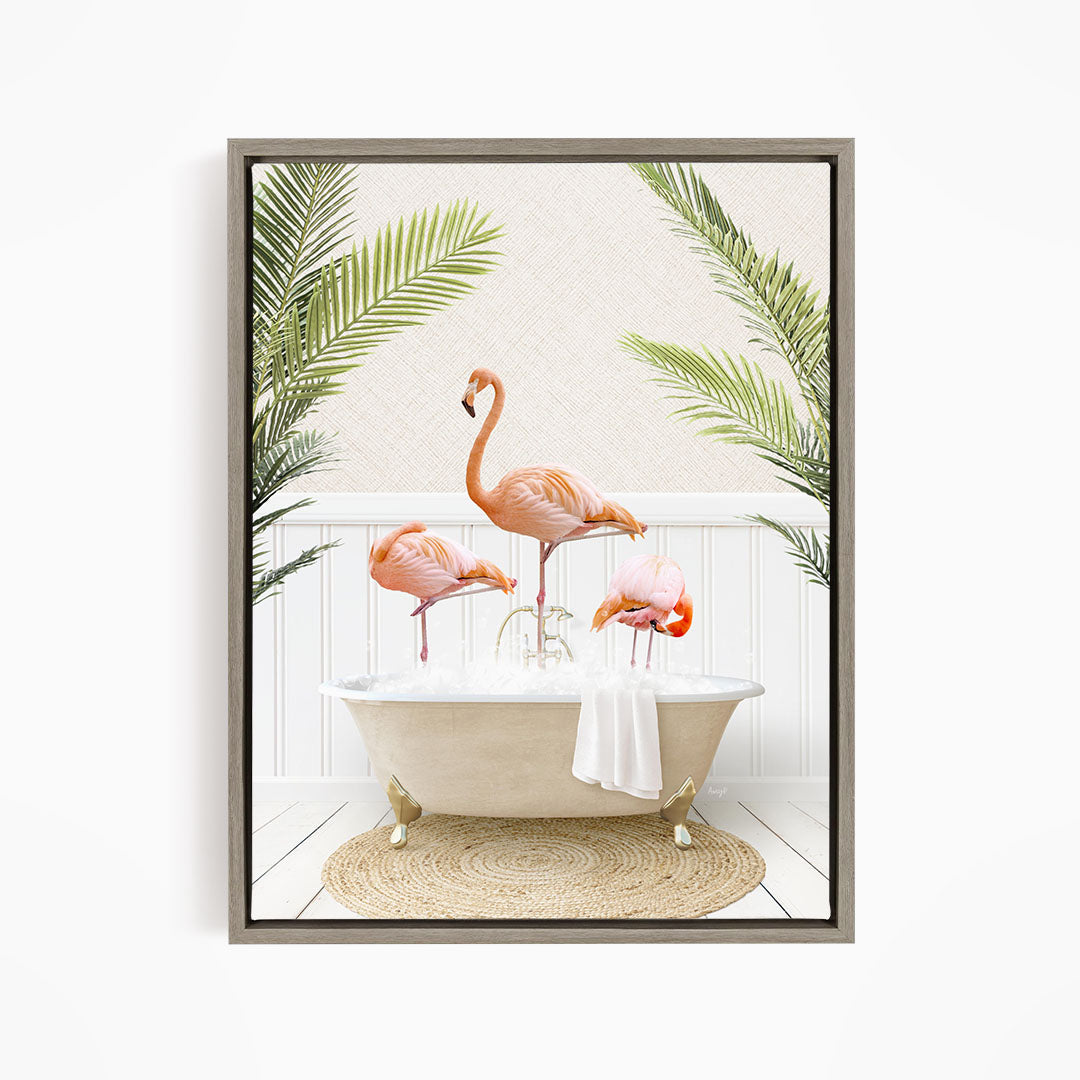 A framed image depicting three pink flamingos standing in a bathtub, surrounded by green palm leaves.