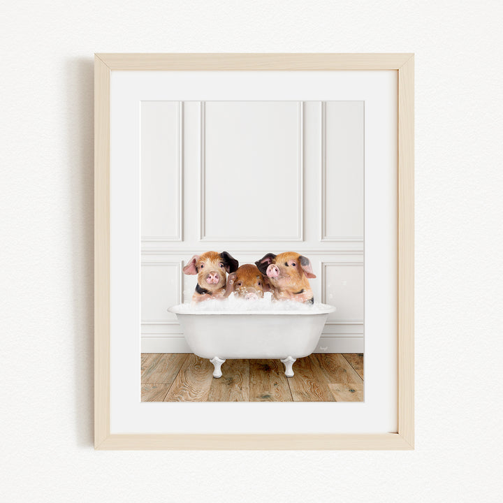 Three adorable pigs sitting in a white bathtub, enjoying a relaxing bath.