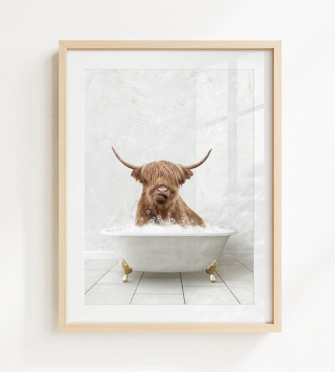 A brown cow with long horns is sitting in a white bathtub filled with water, appearing to enjoy the bath.