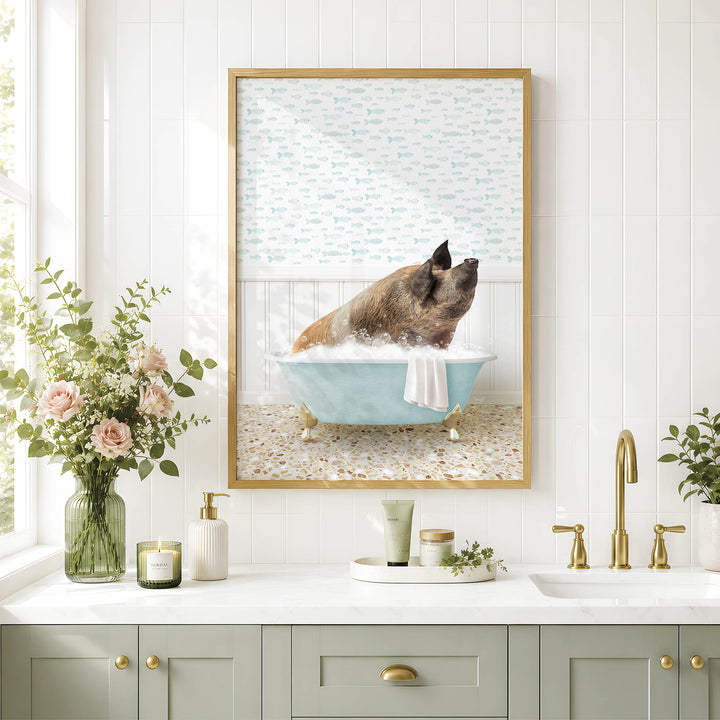 A framed image of a pig sitting in a bathtub, surrounded by flowers and a vase, is displayed on a wall above a bathroom sink.