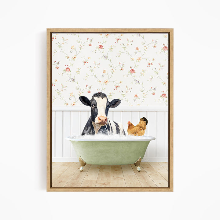 A black and white cow is sitting in a green bathtub, with a chicken standing nearby, against a floral wallpaper background.