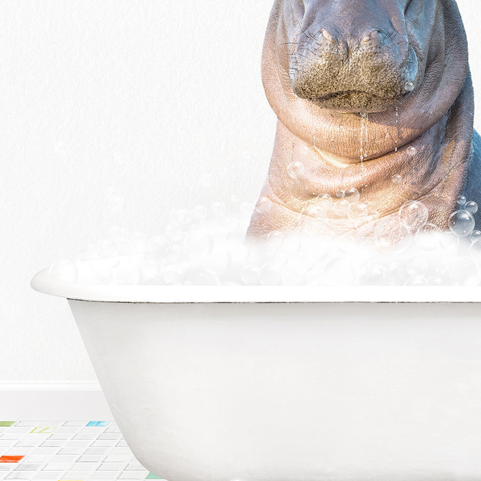 a hippopotamus sitting in a bathtub full of bubbles