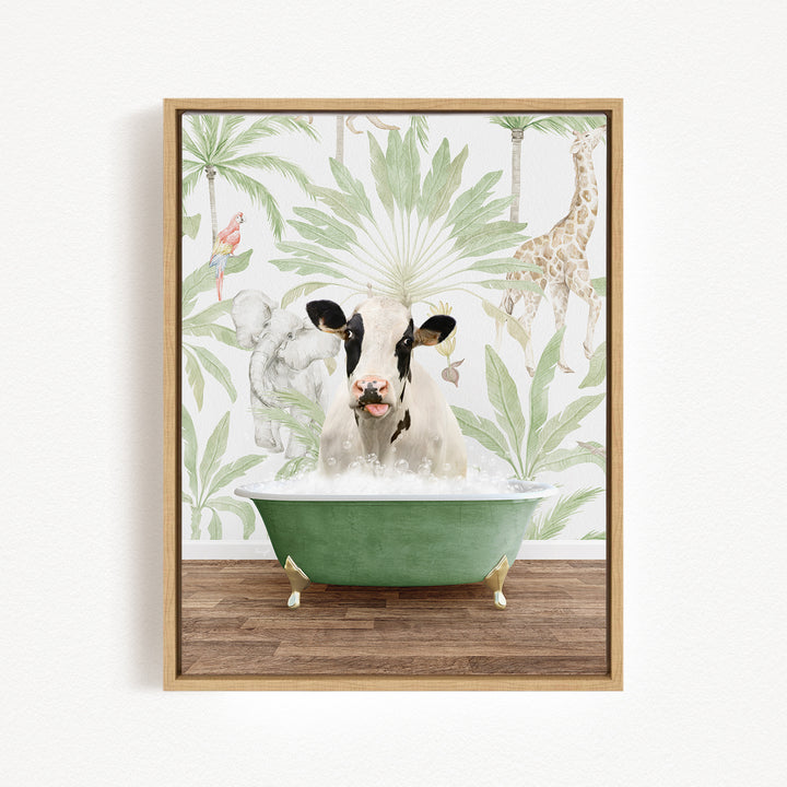 A cow is sitting in a green bathtub filled with bubbles, surrounded by tropical foliage and a giraffe in the background.