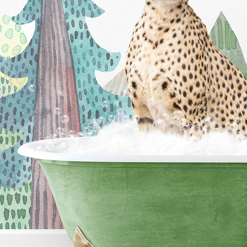 a cheetah sitting in a green bath tub