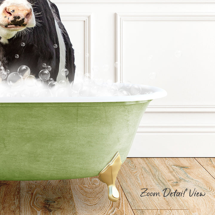 A black and white cow standing in a green bathtub filled with bubbles, with a wooden floor and white wall in the background.