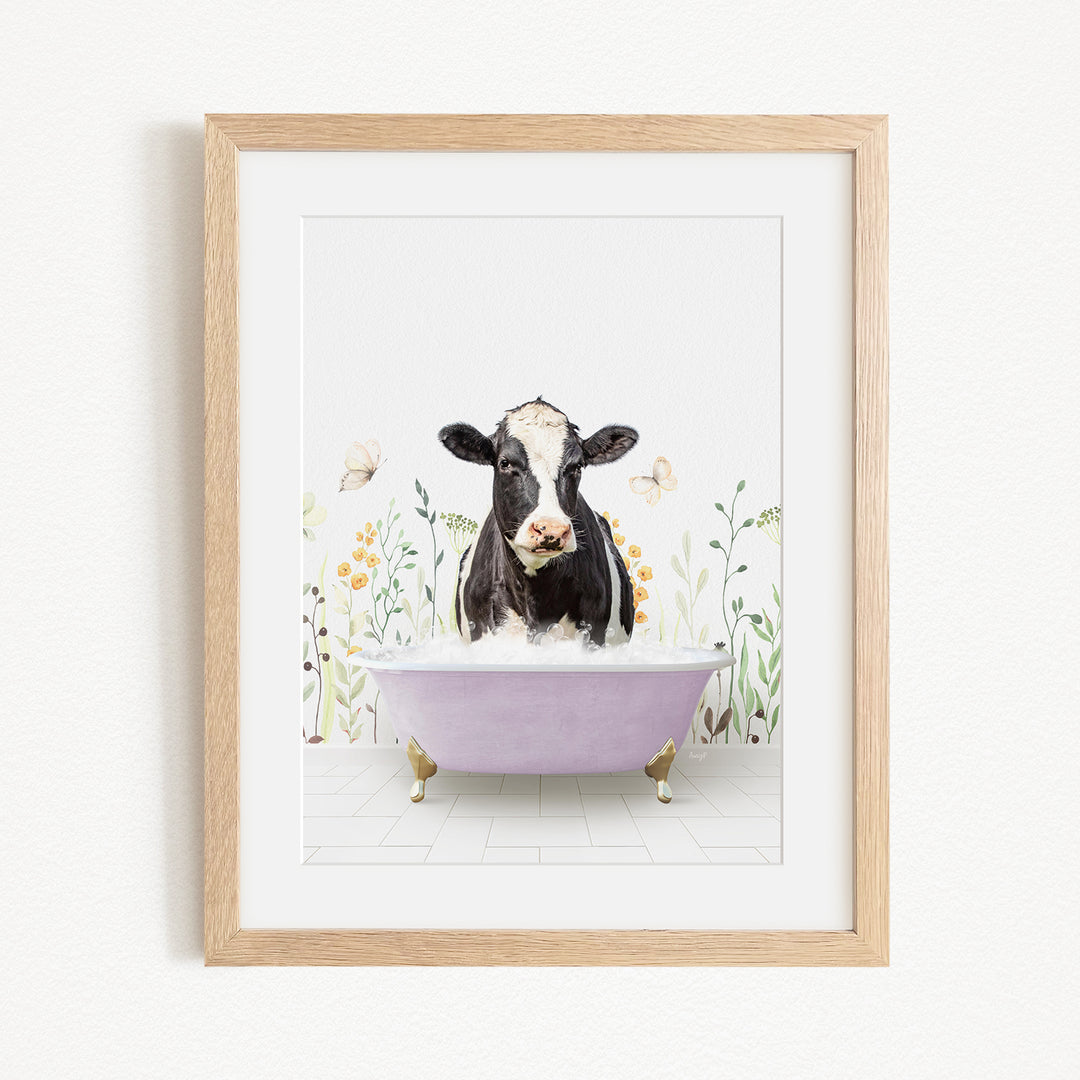 A black and white cow is sitting in a purple bathtub filled with bubbles, surrounded by flowers and butterflies.