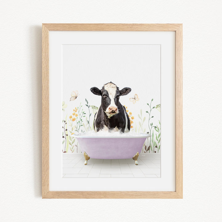 A black and white cow is sitting in a purple bathtub filled with bubbles, surrounded by flowers and butterflies.